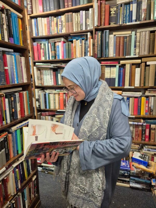Rümeysa Öztürk reads an art book.