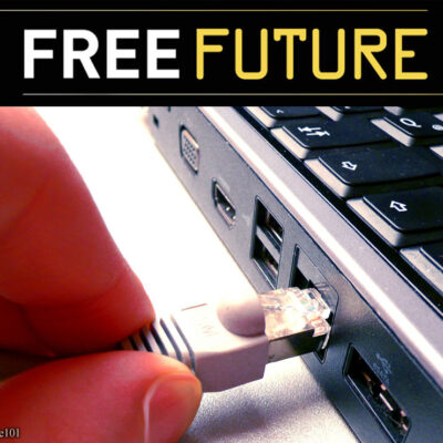 Two fingers disconnecting a network cable from a computer