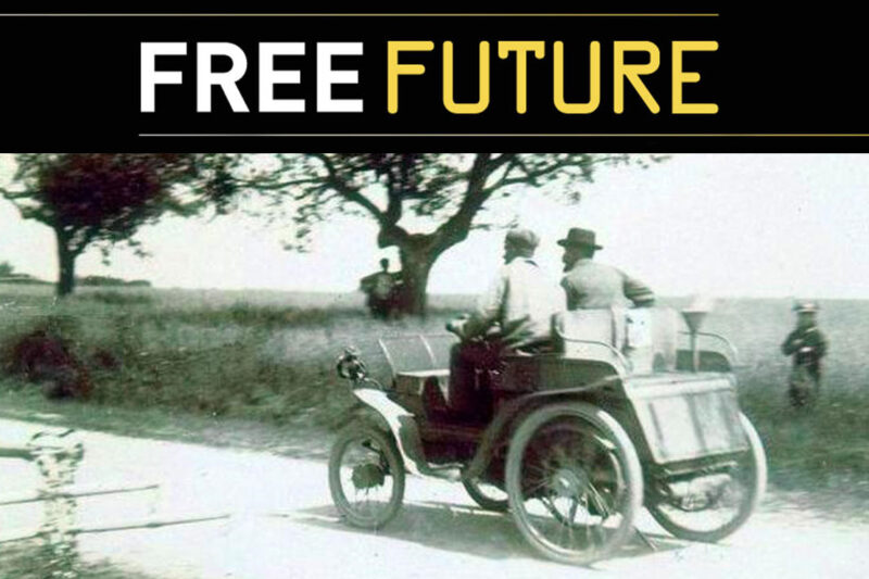 Vintage car driving along a road