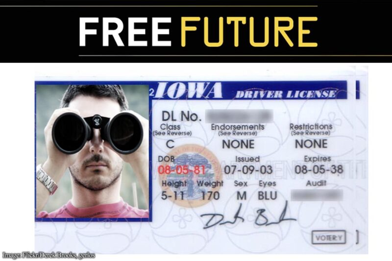 A driver's license in which the photo shows a man peering at the camera through binoculars
