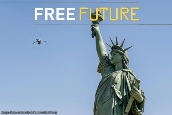 A drone flying in front of the Statue of Liberty