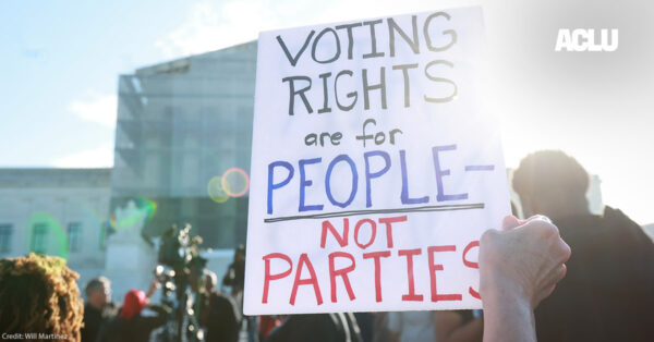 An individuals holding a sign saying "Voting Rights Are For People Not Parties," outside of the U.S. Supreme Court ahead of arguments in the Voting Rights case Callais v. Landry.