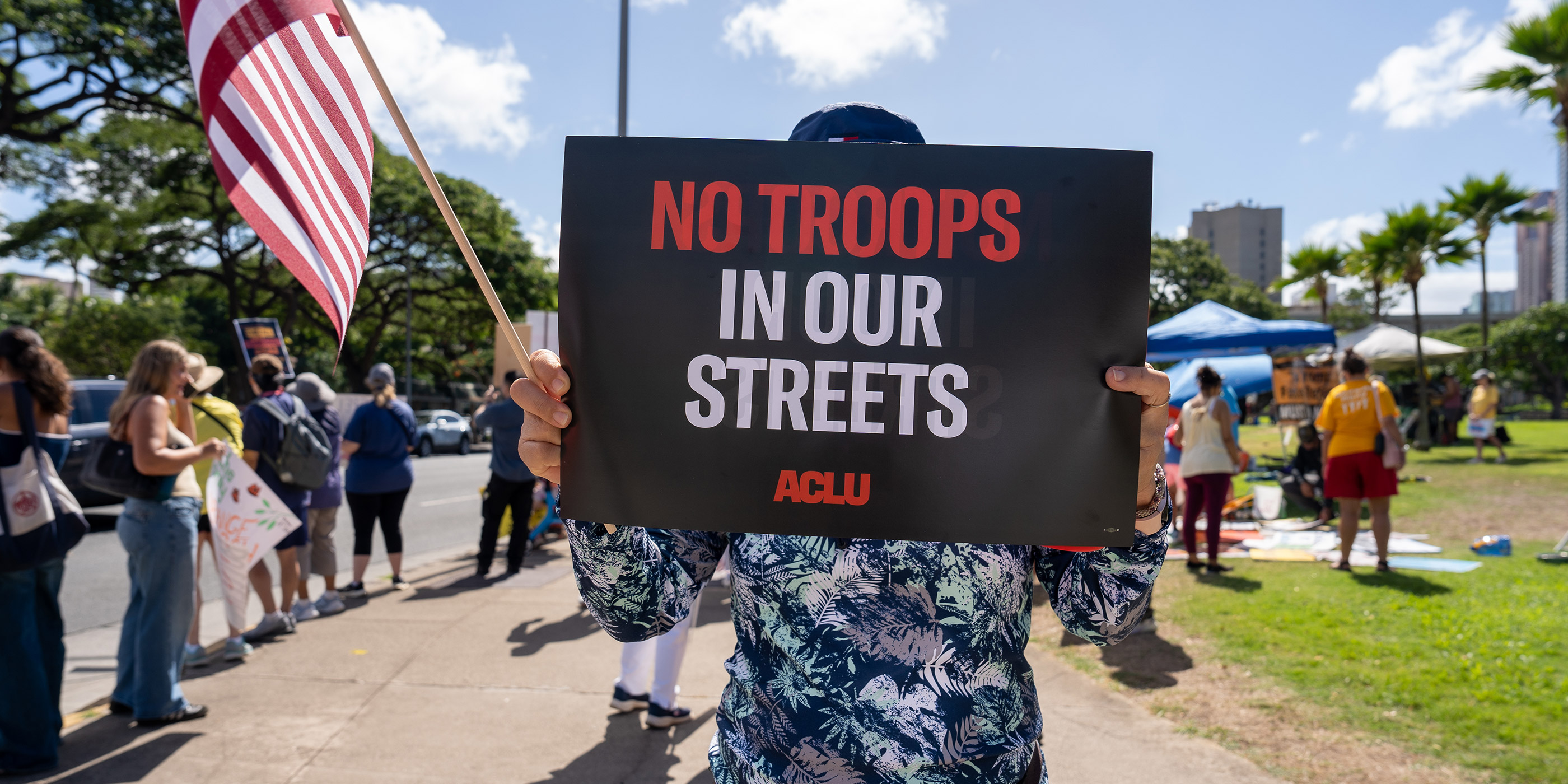 A protest sign that says "No Troops In Our Streets."