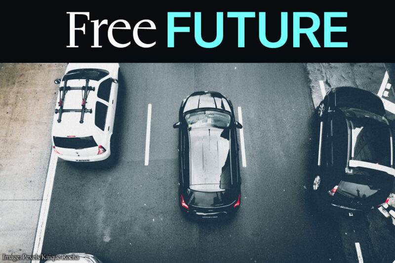 An aerial view of some vans on a street