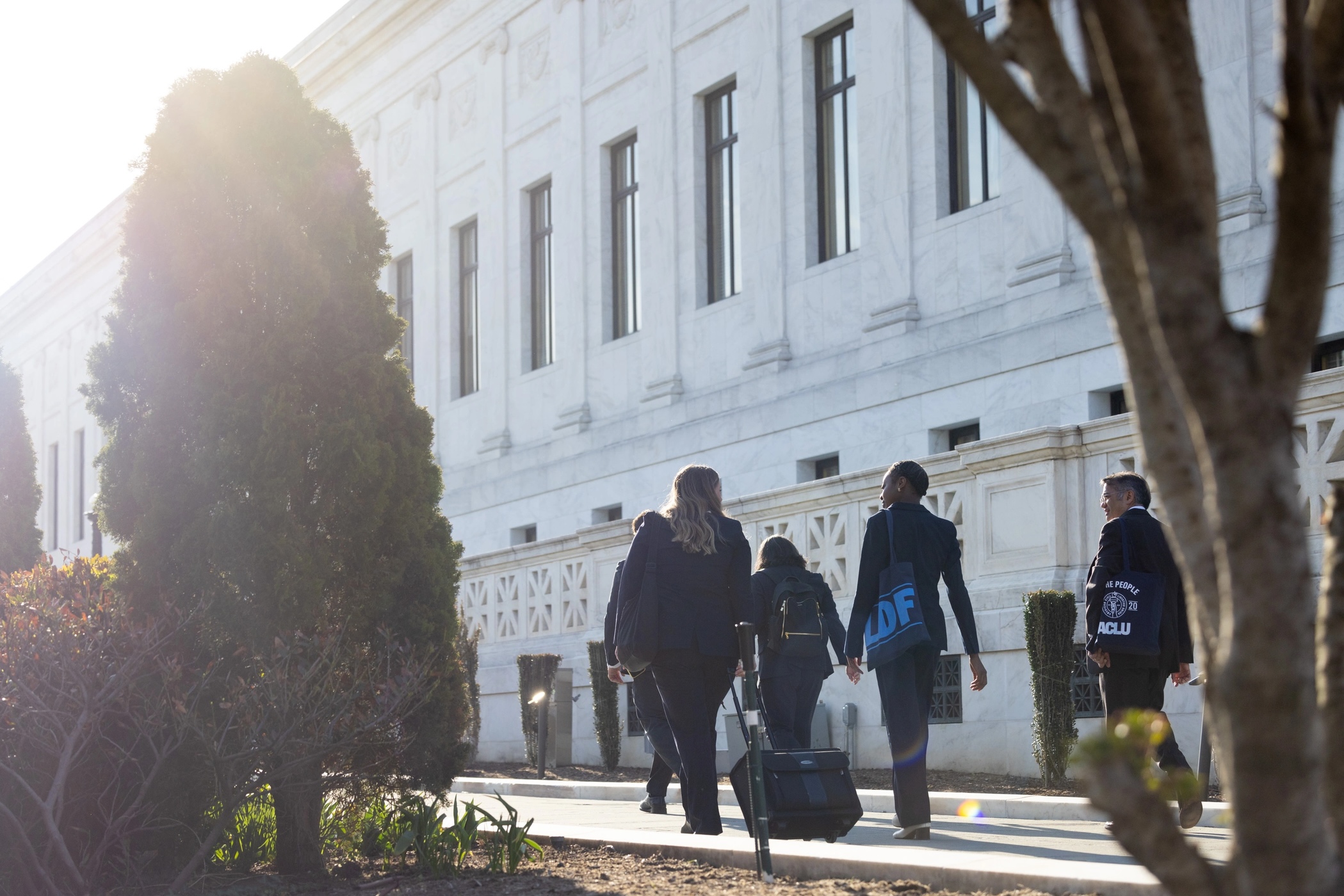 The ACLU legal team and our co-counsel walk into the Supreme Court for oral arguments in Trump v. Barbara.
