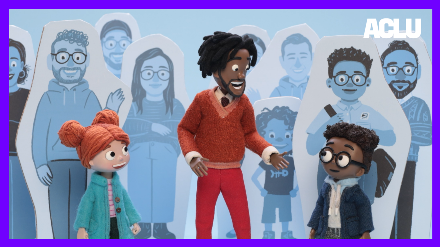 A scene from episode 4: Lisa, Mr. Charles, and Aaron stand among cut-outs of U.S. citizens.