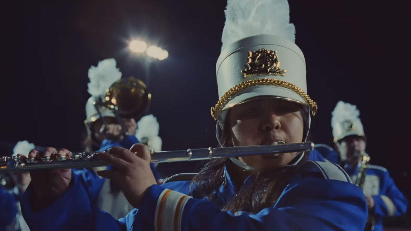 A group of young people playing in a marching band.