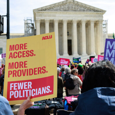 Demonstrators holding posters advocating for reproductive freedom outside of the U.S. Supreme Court in Washington, D.C.