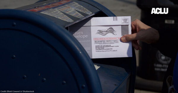 A mail in ballot placed in mail box.