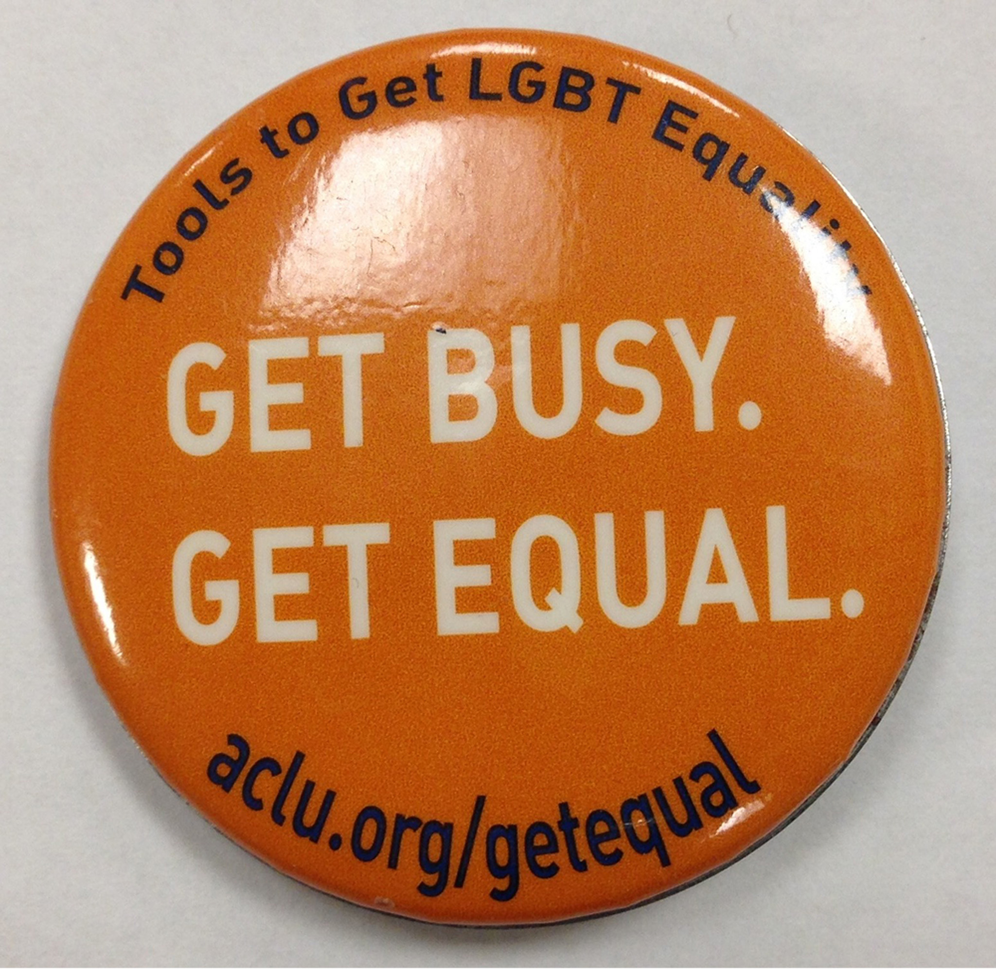Photo of button that reads "Get Busy Get Equal - LGBT Equality"