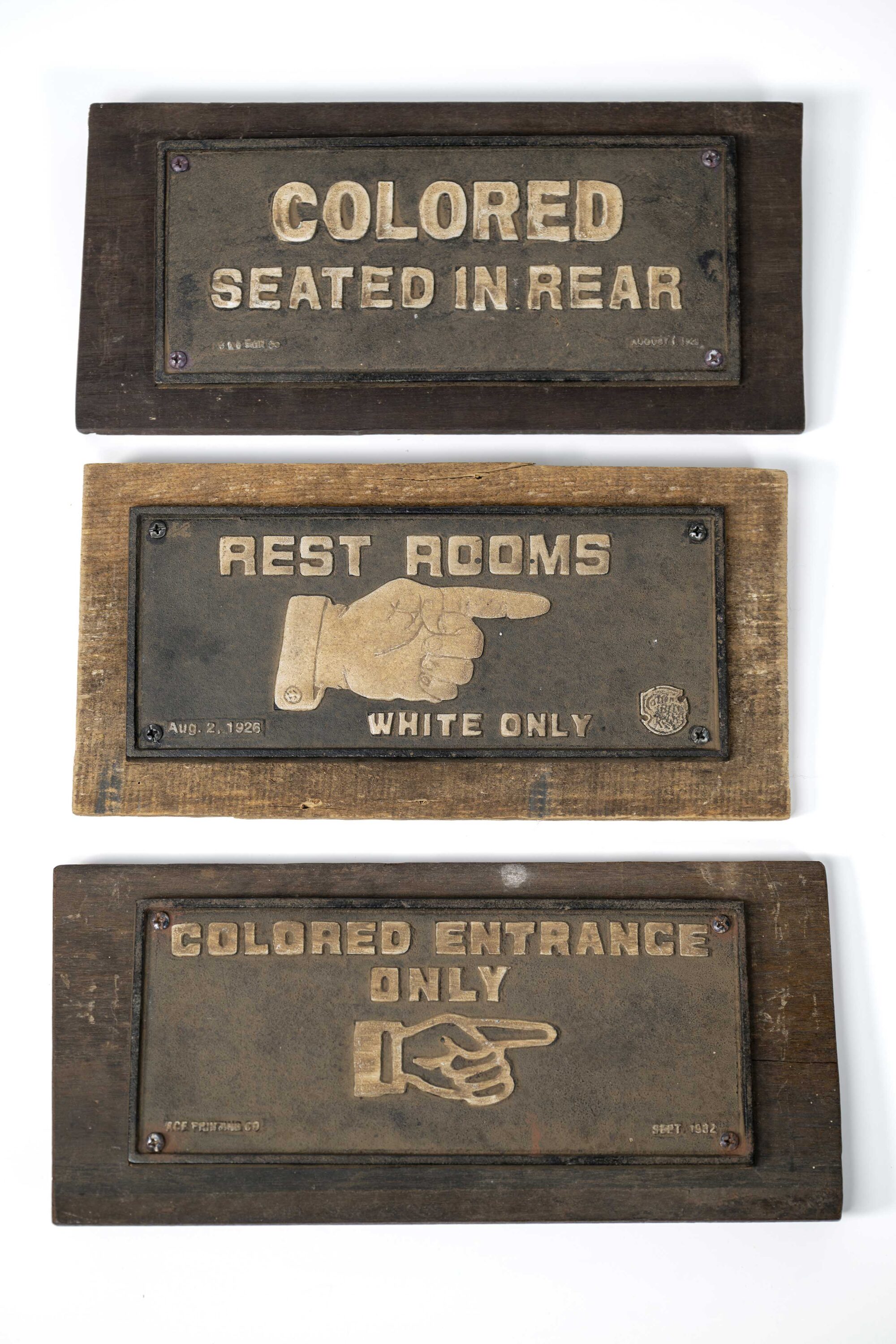 Three Jim Crow era bathroom segregation signs