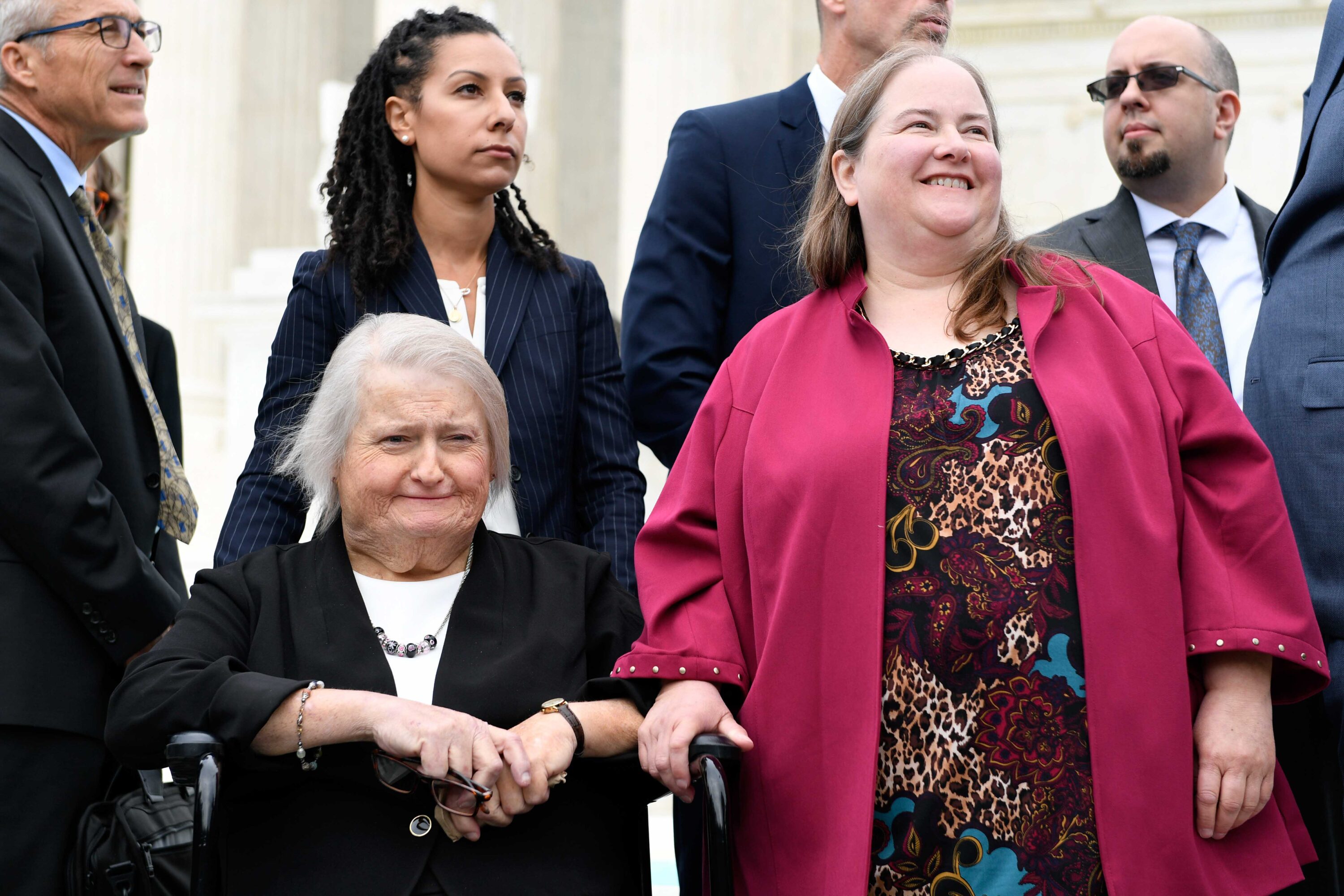 Ria Tabacco Mar, Aimee Stephens and Donna Stephens, outside the Supreme Court