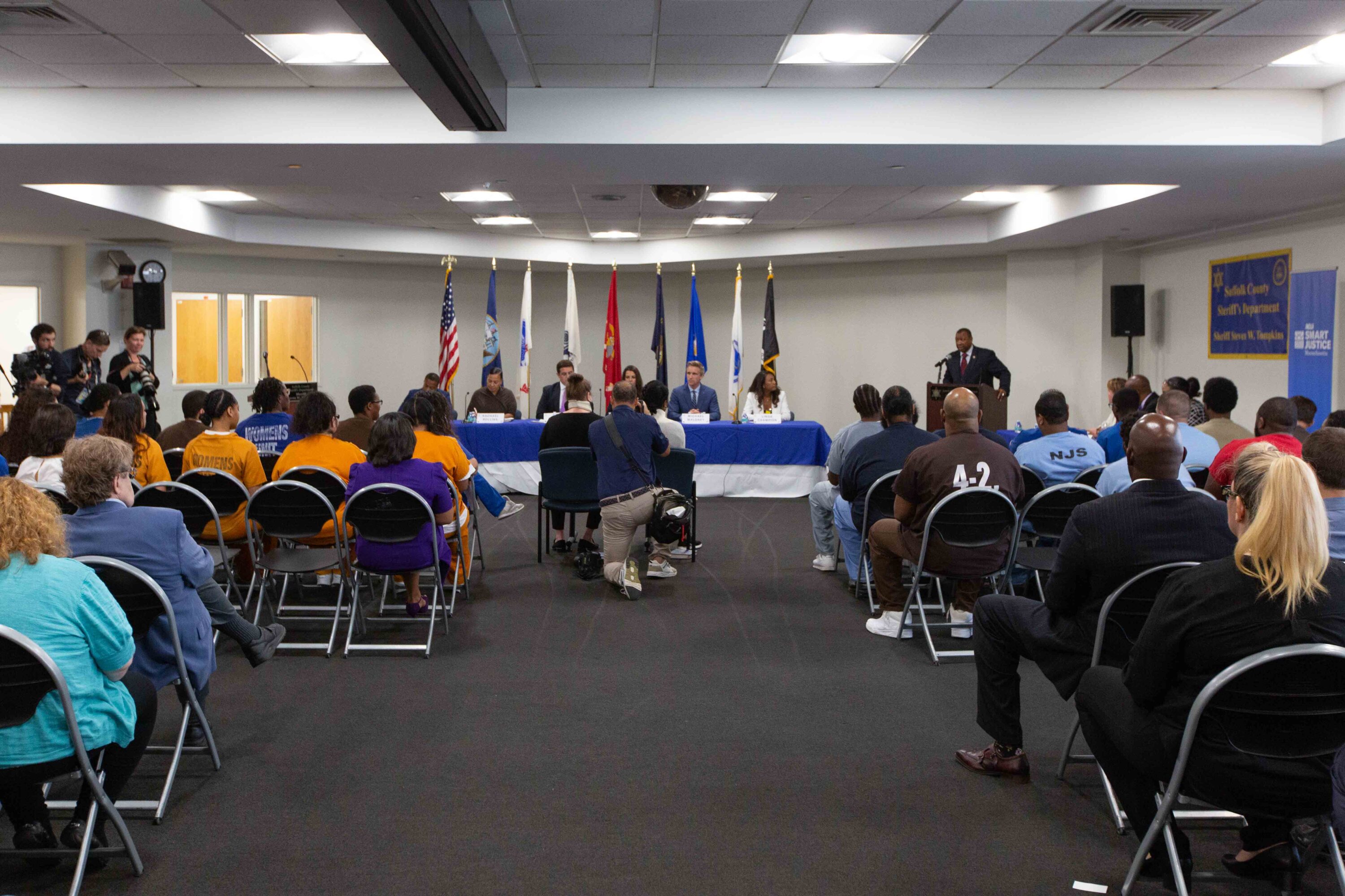 Photo of a large group of people attending a debate