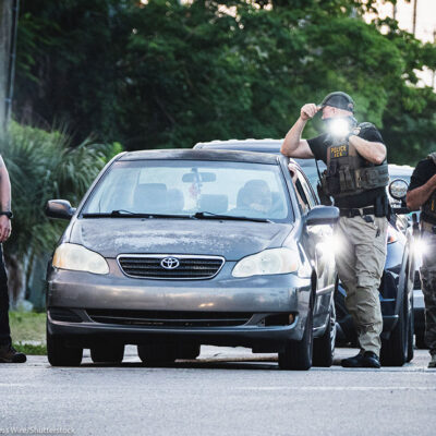 ICE agents temporarily halting a driver.