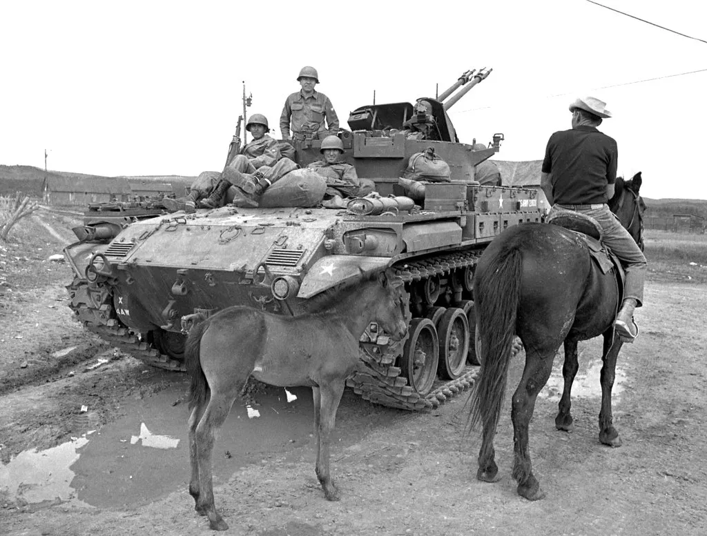 Black and white photo of the New Mexico National Guard tanks and troops search northern New Mexico for land grant activists