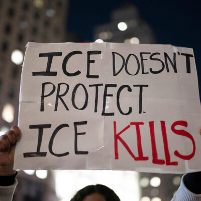 A protest sign that says "ICE Doesn't Protect, ICE Kills."