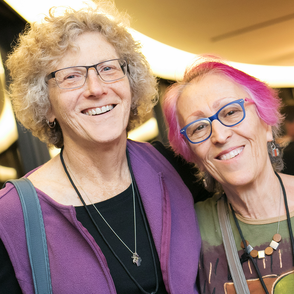 Two people smiling