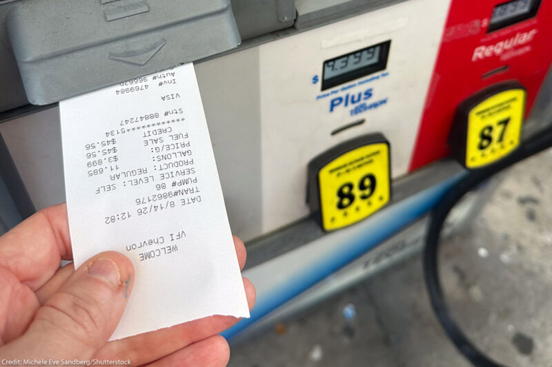 A customer pumps gasoline at a gas station in South Florida as fuel prices remain elevated.